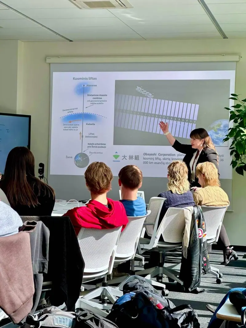 Me presenting a slide about the space elevator while students listen